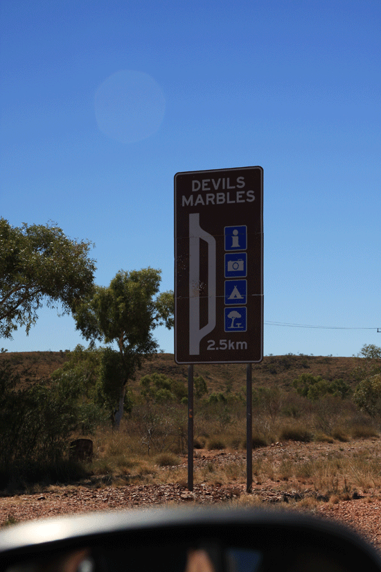 Devils Marbles road side sign to camp